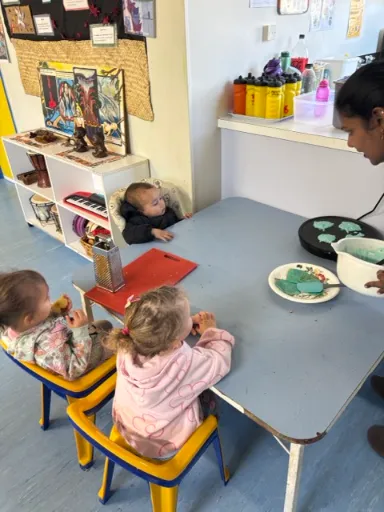 Tamariki sharing kai together at the table